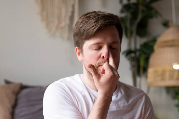 Person practising calm nasal breathing in a quiet room
